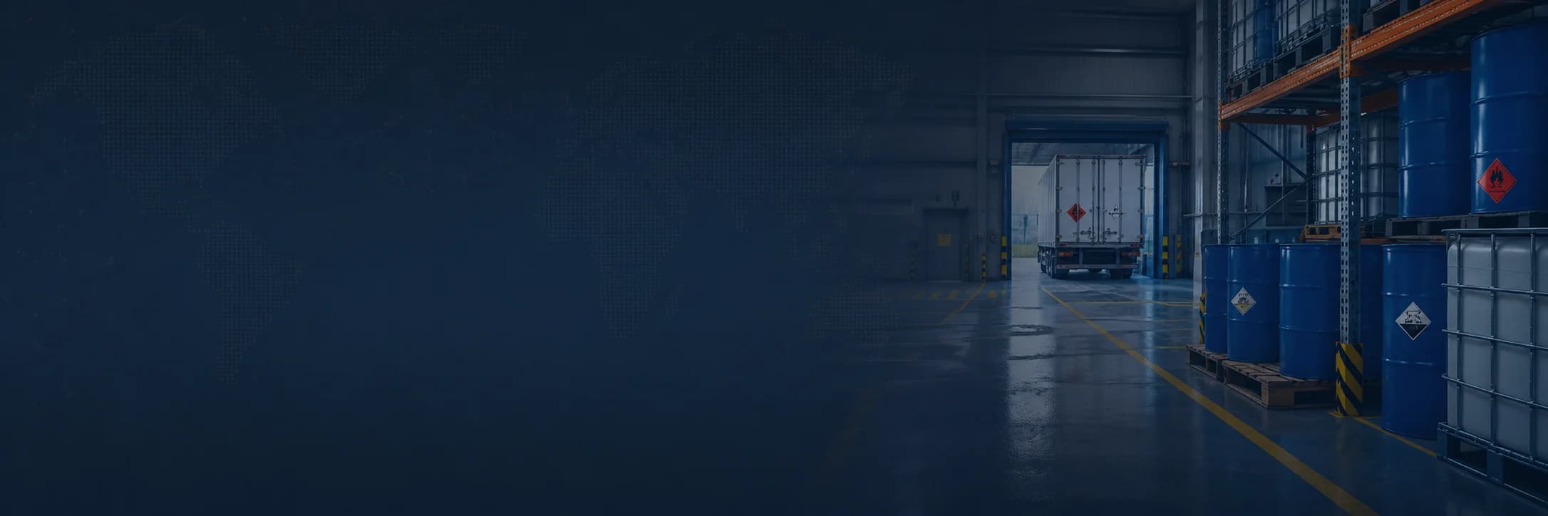 Hazardous materials warehouse with drums, totes, and a freight truck