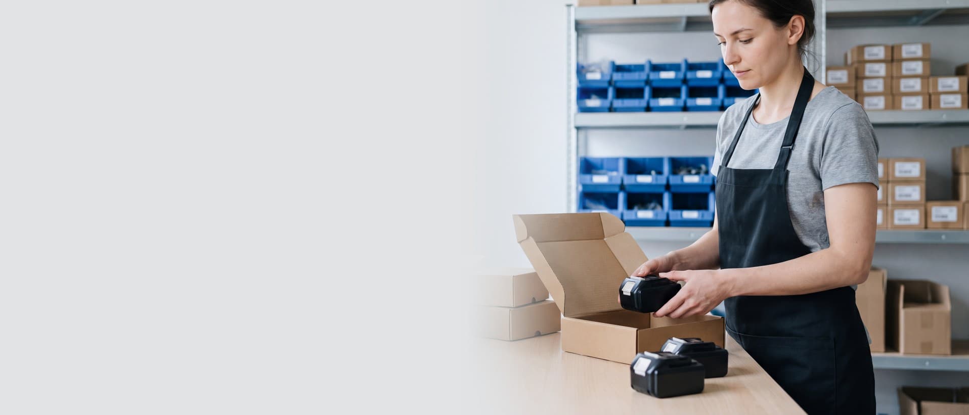 Fulfillment employee preparing lithium battery products for shipment