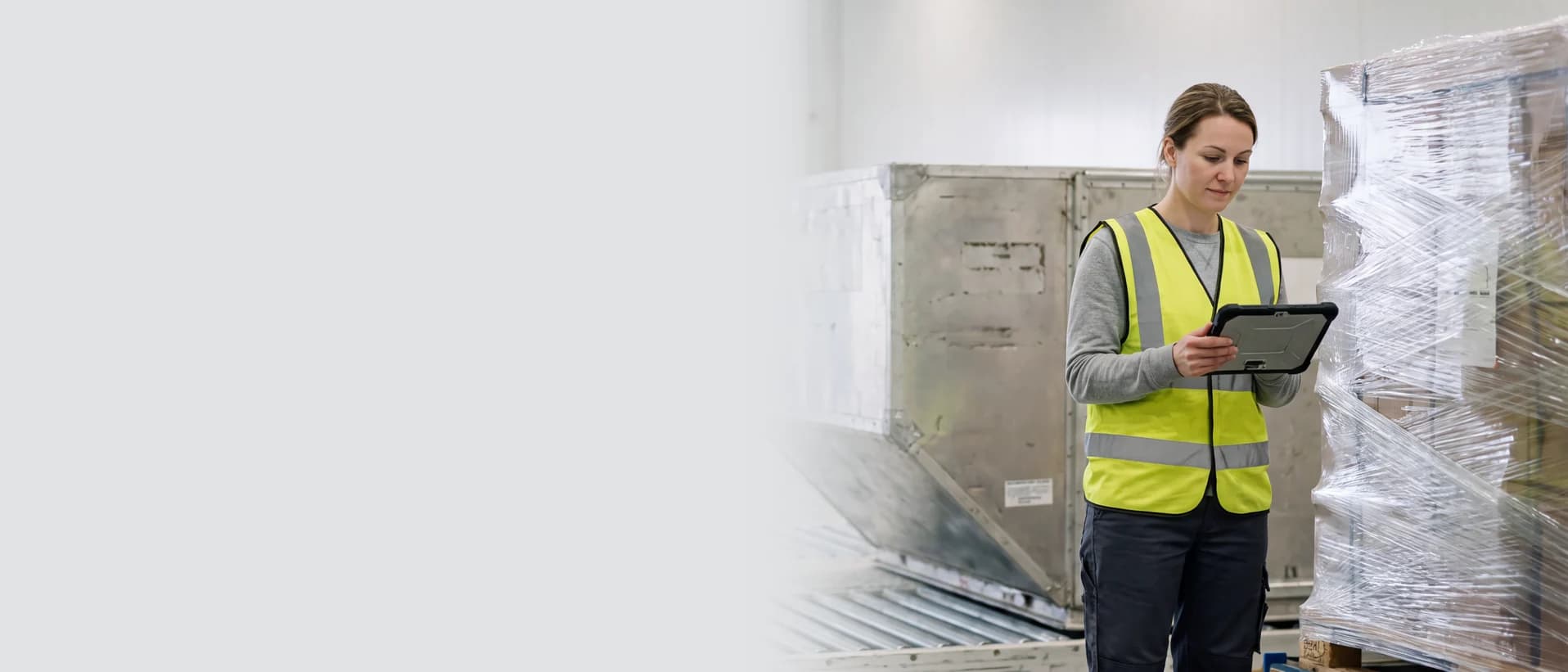 Air cargo employee reviewing freight documentation in a warehouse