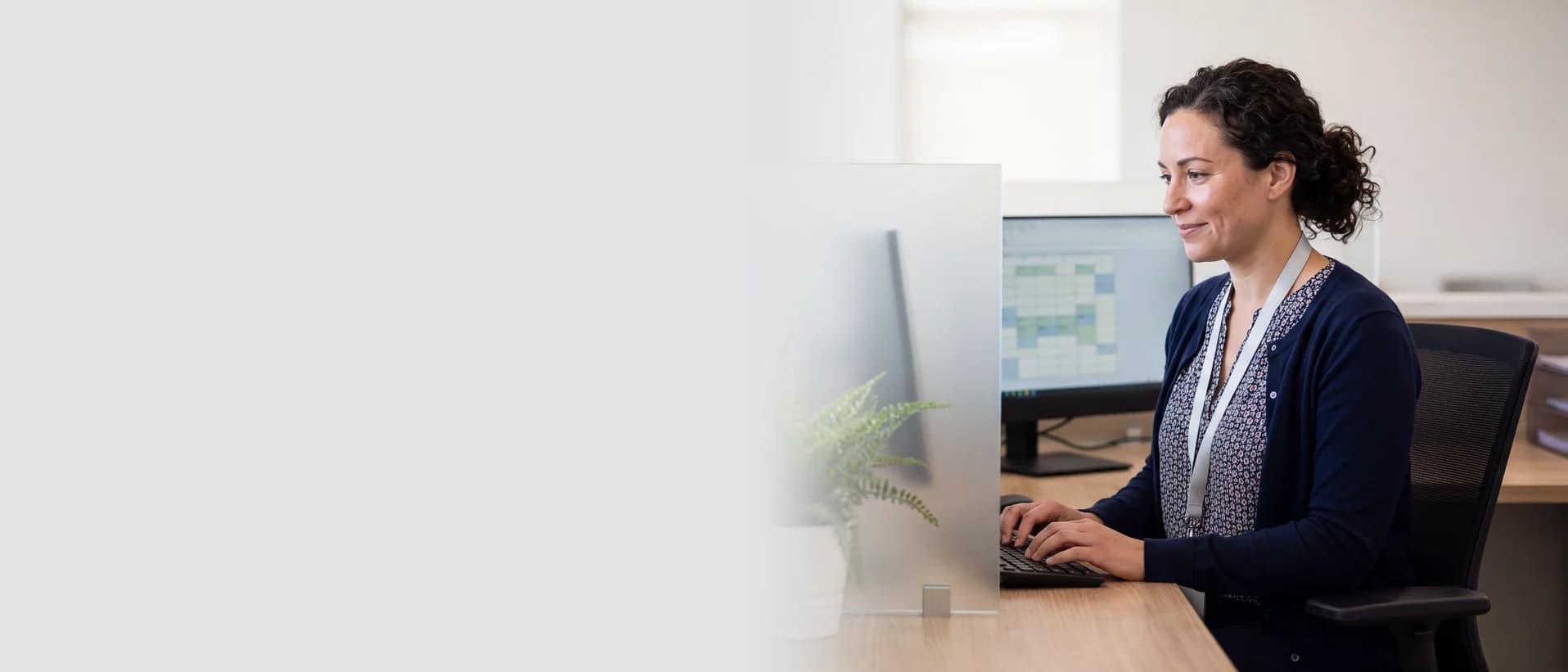 Healthcare administrator working securely at a computer